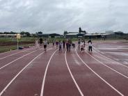 Teacher Casey Robles shares a moment on the track with her second-graders. Photo by Casey Robles