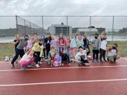 Teacher Lindsay Mendez Garcia's second-graders strike a pose by the tennis courts. Photo by Lindsay Mendez Garcia