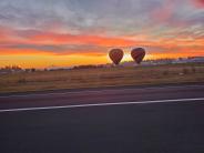 Two hot air balloons complemented a vibrant sunrise on Oct. 19. Photo by David Sheldon