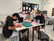 From left to right, seniors Emilio Estrada, Mallory Patzer, and Evan Holman work together in class. Photo by Jillian Daley