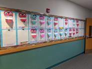 Teacher Meaghan Kitzmiller's class artwork features hearts showing who the children love and why. Photo by Jillian Daley