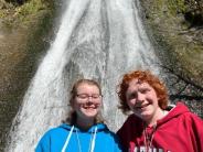 From left to right are eighth-graders Natalie Hostetler and Ben Hankins enjoy a waterfall during a hike at Bonneville April 1.