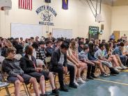 Students wait to receive their eighth-grade certificate during the Eighth-Grade Celebration on Tuesday.