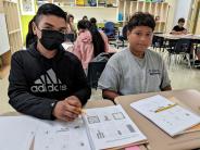 Joram Vazquez Renteria, left, and Giovanni Guerrero Alexander complete an assignment.