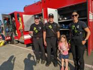 From left to right are Aurora Fire District firefighters Skyler Moffett, Paul Tice, Melissa Coggins.