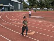 Antonio Torres, 3, hops down the track , while mom Dalia Torres (not pictured) looks on.