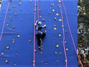 Ember Goms conquers her fear of heights and goes climbing at Salem Ropes. Photo by Chelsea Landry