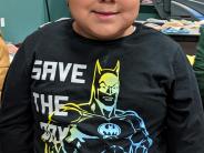 Kindergartner Antonio Guerrero Ramirez chose the hat he wanted carefully and then beamed as soon as he put it on. 