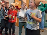 North Marion kindergartners called out to staff as they stepped in time during the Dec. 14 Reindeer Parade.