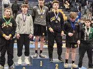 HS Wrestlers standing on Podium
