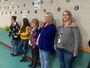 Teachers watching students perform