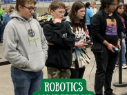 Student watching their robot perform