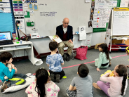 Adult reading to students