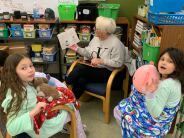 Adult reading to students
