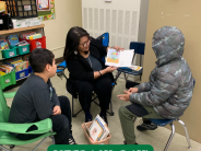 Adult reading to students