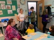 Adult reading to students