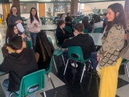 Students listening to a teacher