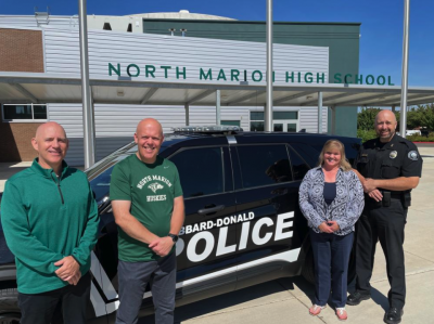 NMSD Staff with Hubbard PD in front of police car.