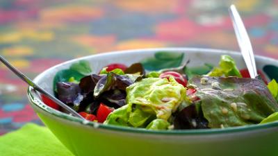 Fresh green salad in a green bowl