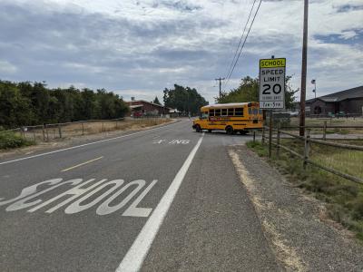 A bus rolls down Grim Road. Photo by Jillian Daley