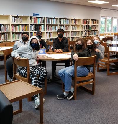 The Middle School (MS) AVID crew creates Giving Tree posters in the MS library. Photo courtesy of Marie Jones