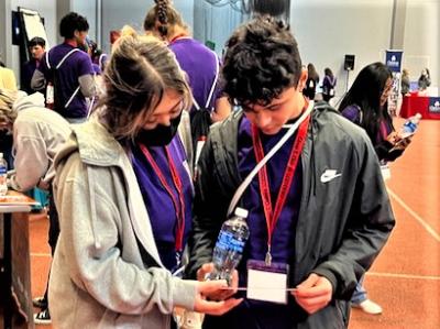 Ashley Delgado and Jonathan Ramirez pause to look at materials during the College and Career Fair. Photo by Rafael Pelaez