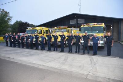 Woodburn Fire District firefighters stand by their engines. Photo courtesy of Woodburn Fire District