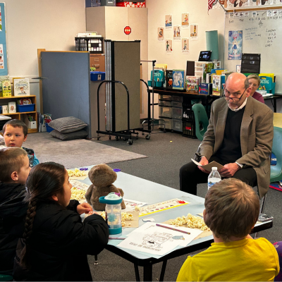Superintendent Reading to students