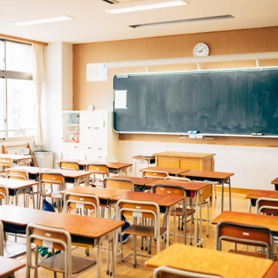 Image of a classroom filled with empty desks