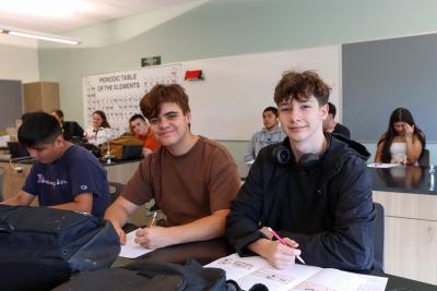 Two students sitting in class