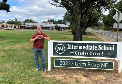 Intermediate School Principal David Sheldon offers a warm welcome to his students! Photo by Peggy Casto