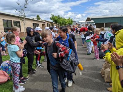 Fifth-graders take a celebratory walk at the end of the school year in 2022. Photo by Jillian Daley