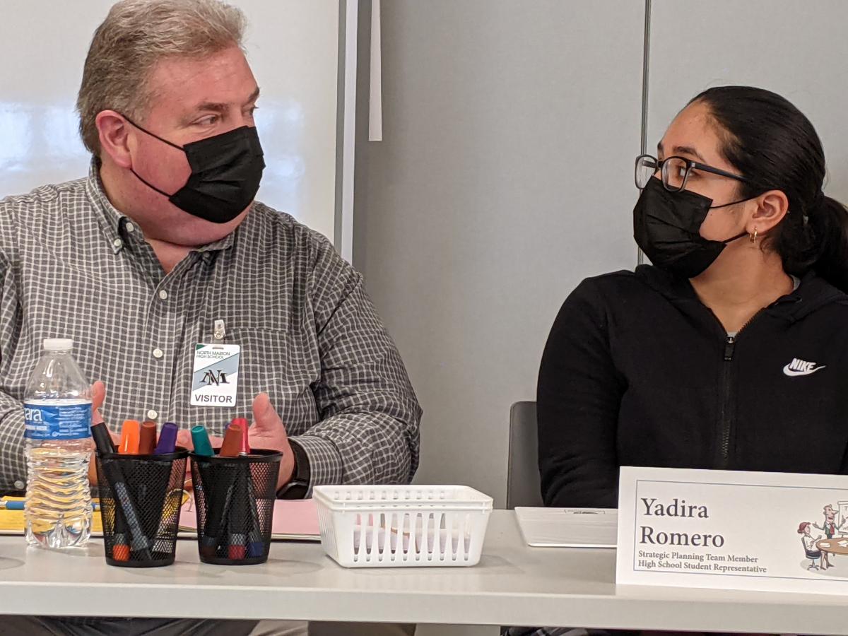 Christ Lutheran Church Pastor Craig Johnson, left, and High School junior Yadira Romero Navarro exchange ideas during a Dec. 13 