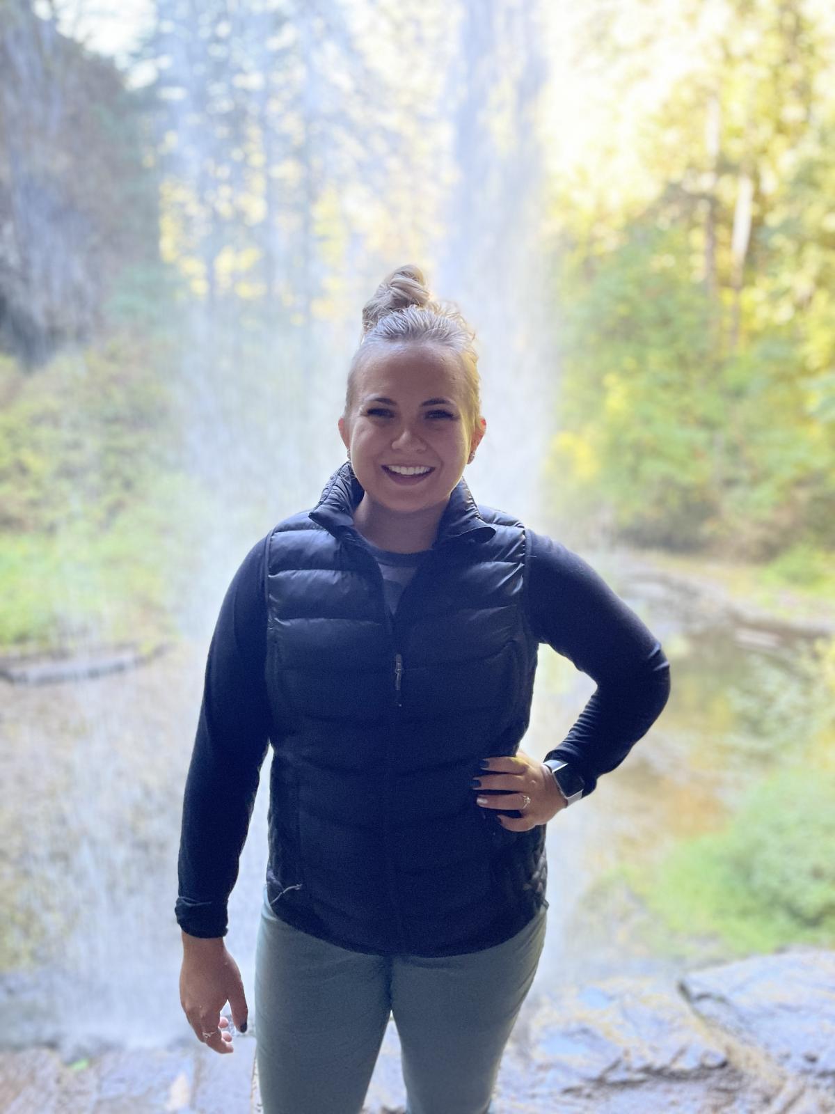 Middle School Counselor Kira Luscher loves hiking with husband, Lane, and dog, Nova at places like at Silver Falls State Park.