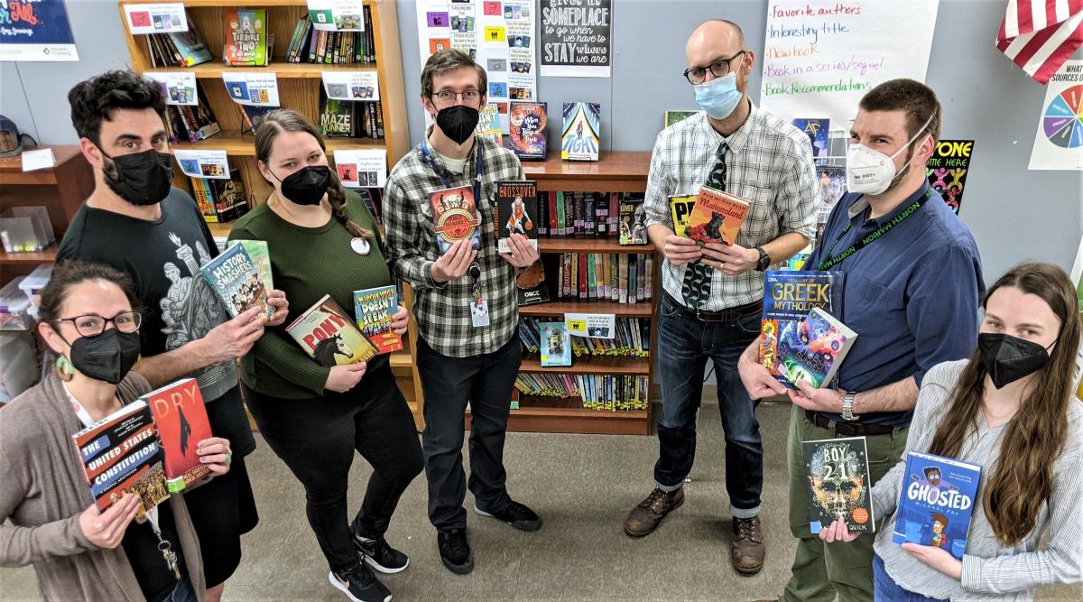 From left to right are: Teachers Chelsea Landry, Will Wenger, Kelly McGuffie, Mat Demski, John Young, Timothy Treen, and Kestrel