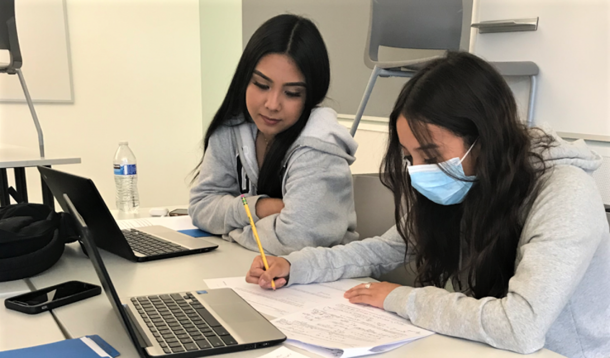 Sophomores Yahaira Candelario Salcedo, left, and Valeria Martinez Cabrera finish assignments during Summer School.