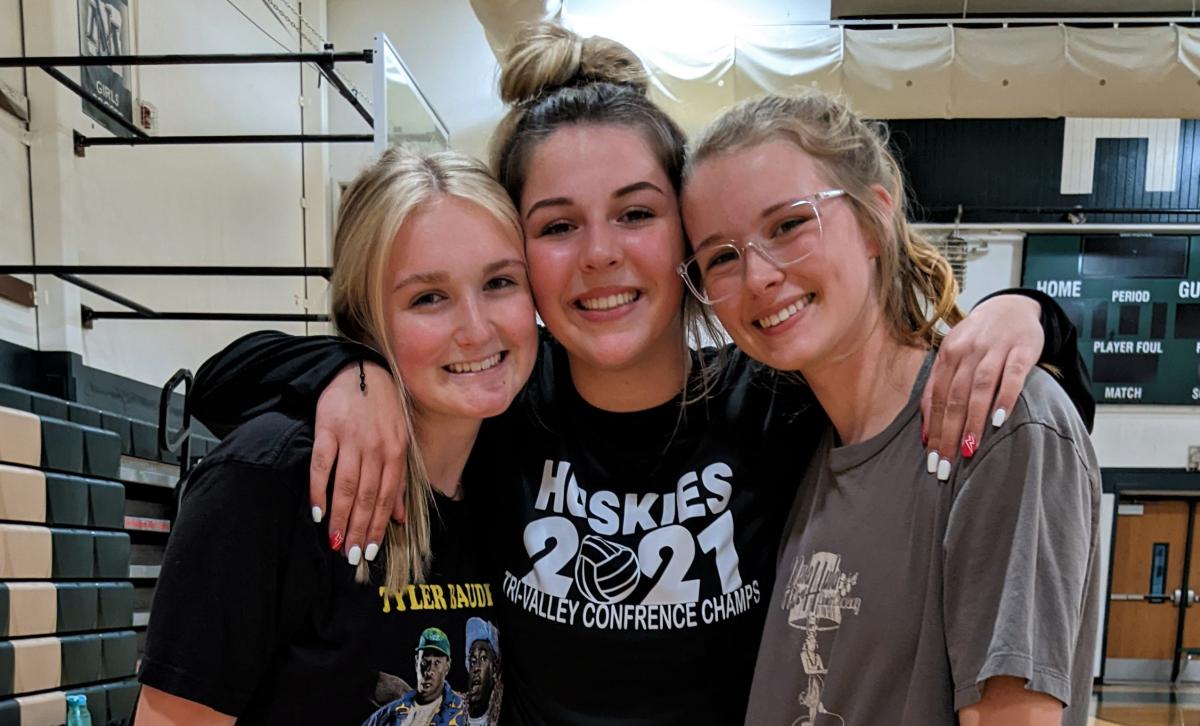 From left to right are North Marion athletes Becca Rand, Shay Coello, Clara Miller taking a break during practice.