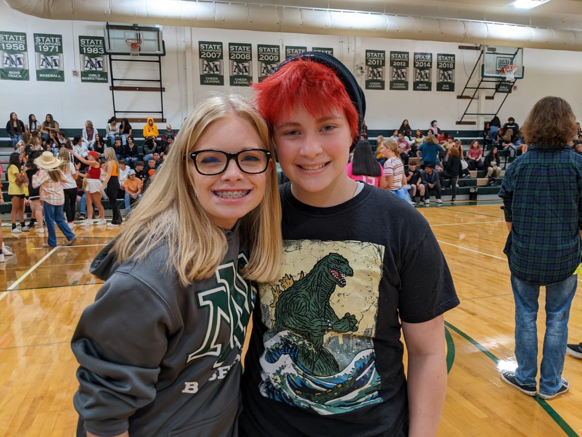 Ninth-graders Adeline Walters, left, and Claire Leder were thrilled to see all their friends again during Freshman Orientation.