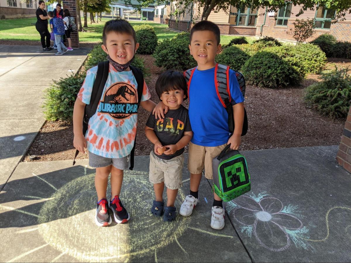 From left to right are: first-grader Liam Gulick, 2-year-old Myles Gomez, and first-grader Elijah Gomez