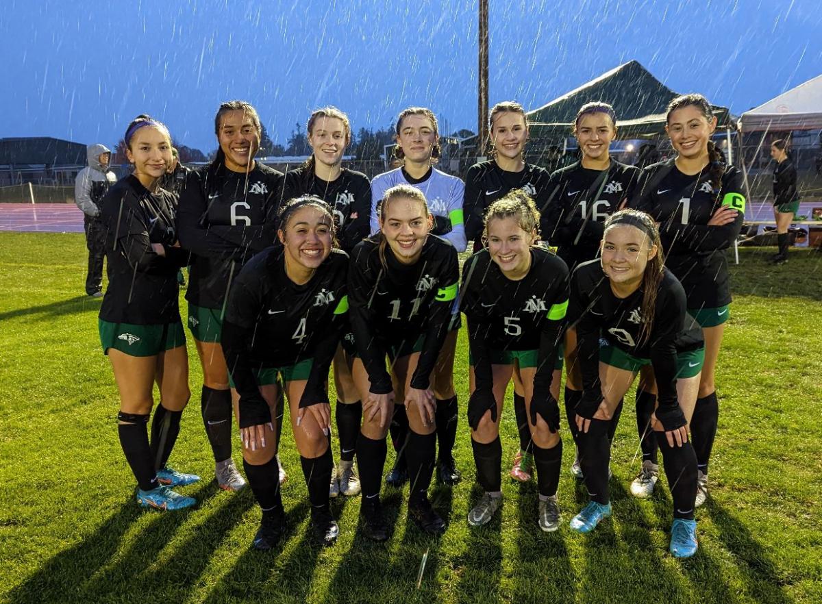 The North Marion Girls Soccer team is water proof! Go, Huskies! Photo by Mike D'Adamo