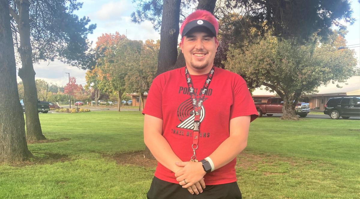 Intermediate School PE Teacher Matt Prom dyed his hair fluorescent pink after his students reached a goal in the fall Fun Run.