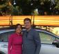 Richard Goddard and Wendy Véliz stand by their car with a canoe on the top of it. Photo courtesy of Goddard