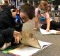 First-graders Estevan and Soraya study arachnids. Photo by Josh Mitchell