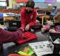 Robotics students — including, from left, Phoenix Moss, Aiden Vigus, and Madison Sturm — assemble a 'bot! Photo by Jillian Daley