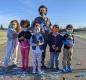 Primary School Principal Allison Hunt with, from left: Kendall Pinola, Becca Sims, Masha Oliva, Kelvin Gerdes, & Koda Pinola