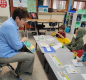 Superintendent Ginger Redlinger makes the time to read in Teacher Tami Esmay's class. Photo by Tami Esmay