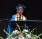 A valedictorian speaks at the podium during commencement in 2022