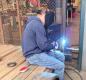 Sophomore Henry Kirsch practices welding under the watchful eye and guidance of Teacher Damian Trammel. Photo by Damien Trammel