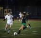 Paige Comerford dribbles down the field, while a Pendleton player strives to gain control of the ball. Photo by Natalie Parmente