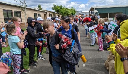 Fifth-graders take a celebratory walk at the end of the school year in 2022. Photo by Jillian Daley